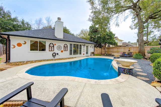 view of swimming pool with a patio area