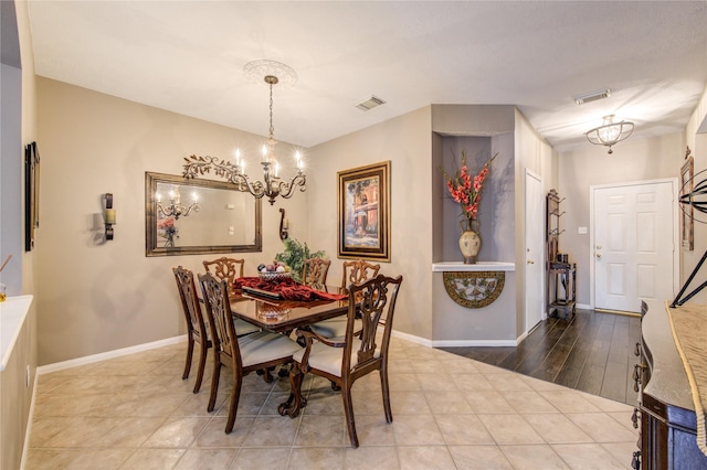 dining space with a chandelier