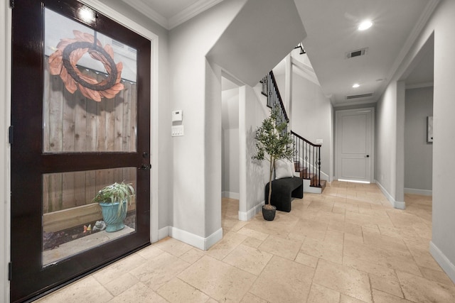 entryway featuring ornamental molding