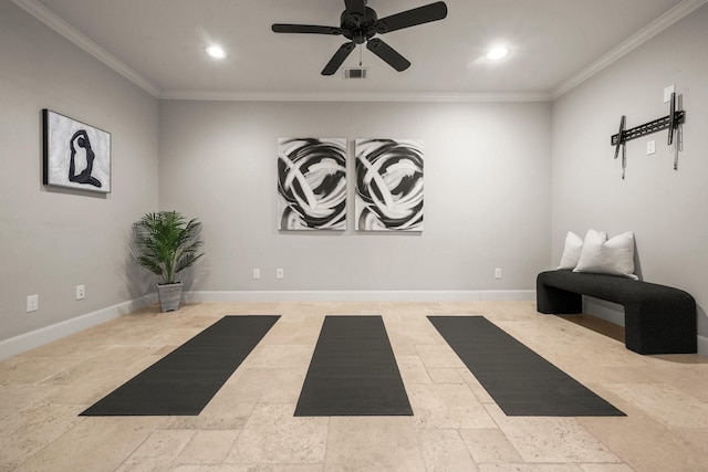 workout room featuring ceiling fan and ornamental molding