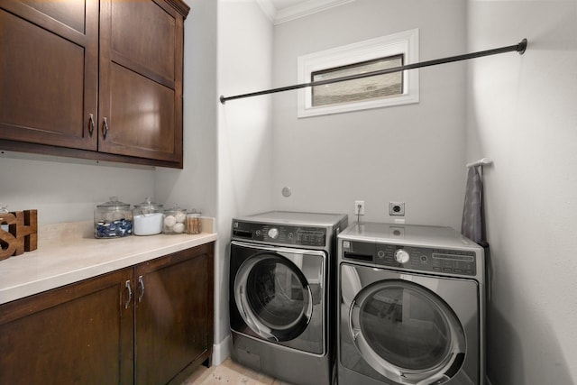 clothes washing area with cabinets, separate washer and dryer, and crown molding