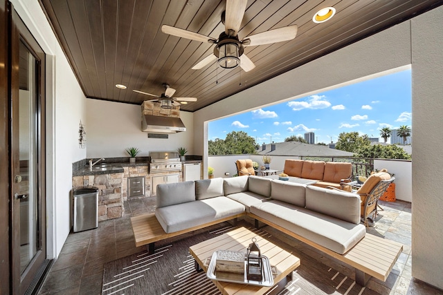 view of patio with an outdoor living space, a grill, sink, and area for grilling