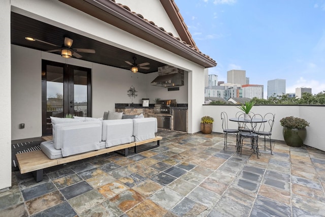 view of patio featuring ceiling fan and grilling area