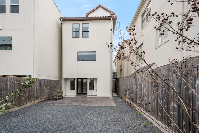 rear view of house featuring a patio