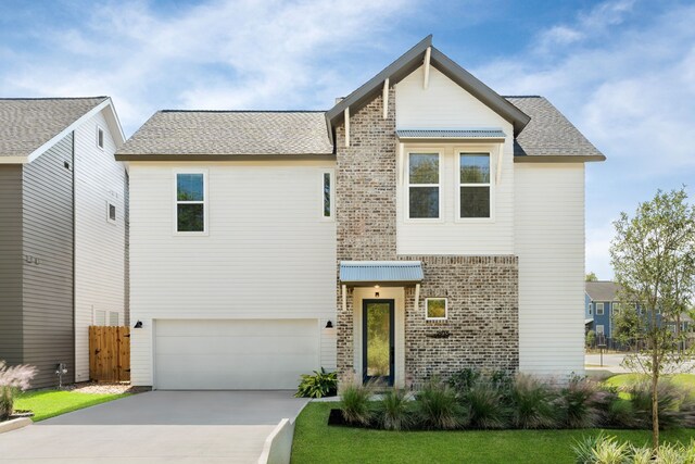 view of front of property with a garage