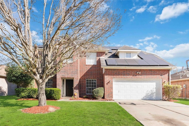 view of front of home with a front yard, solar panels, and a garage