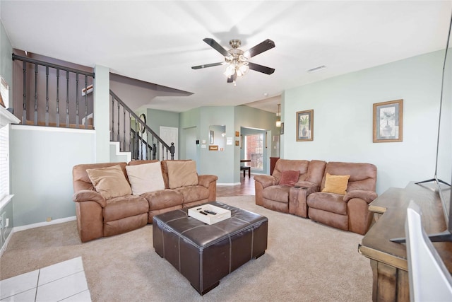 living room featuring ceiling fan and light carpet