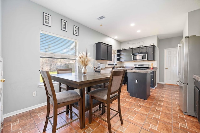 dining space featuring sink