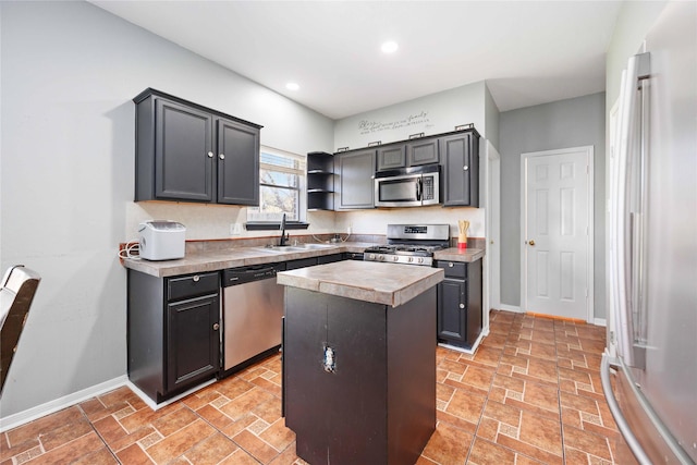 kitchen featuring sink, a kitchen island, and stainless steel appliances