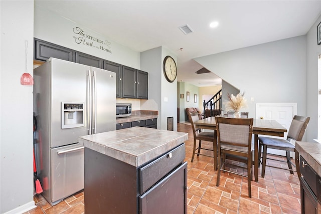 kitchen with a kitchen island and stainless steel appliances