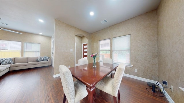 dining space featuring ceiling fan and dark wood-type flooring