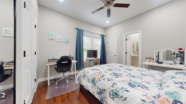 bedroom with ceiling fan, dark hardwood / wood-style floors, and ensuite bath