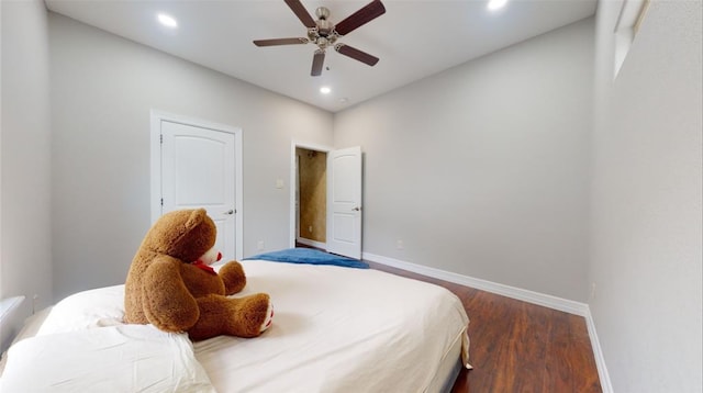 bedroom featuring dark hardwood / wood-style flooring and ceiling fan