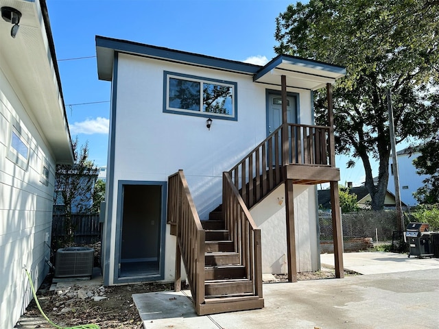 back of property featuring a patio area and cooling unit