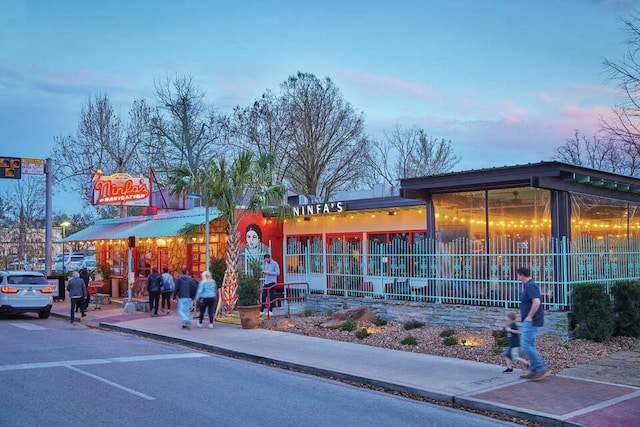 view of outdoor building at dusk