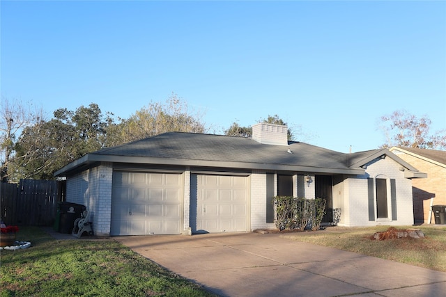 ranch-style home featuring a garage