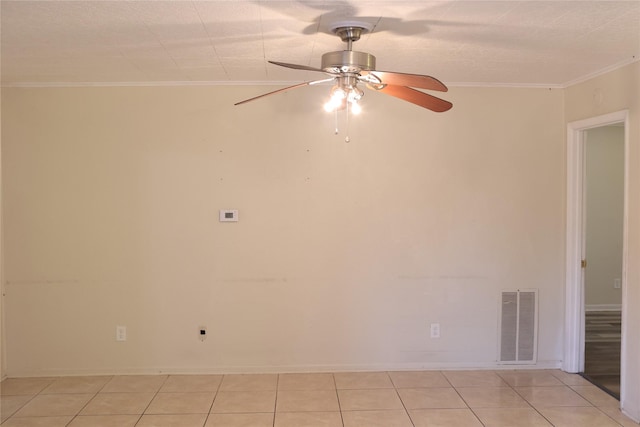 unfurnished room with light tile patterned floors, ceiling fan, and crown molding