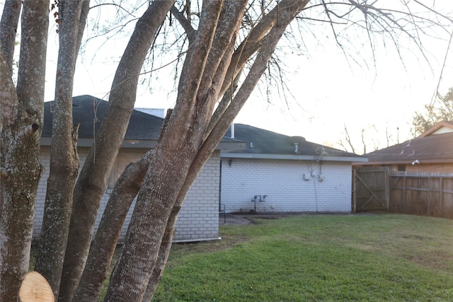 back of house with a lawn