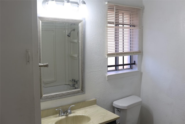 full bathroom with vanity, shower / bathtub combination, and toilet