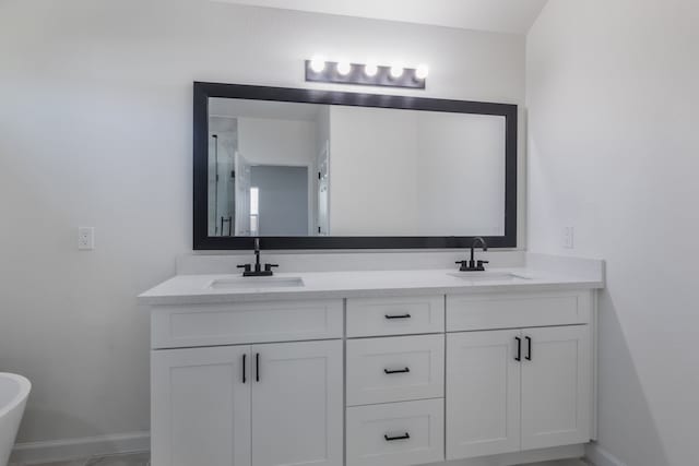 bathroom featuring vanity and a shower with door