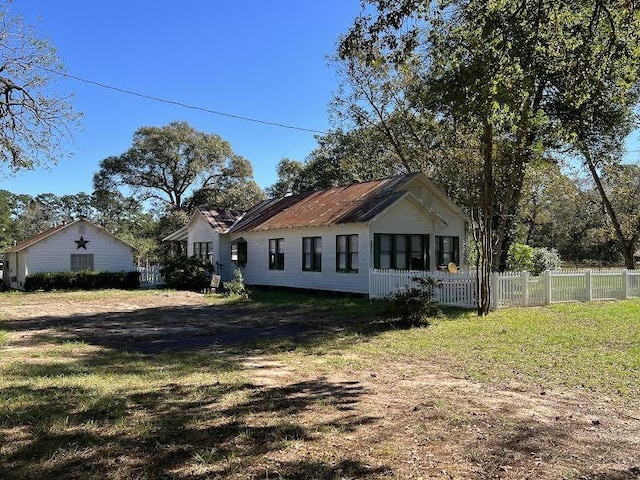 view of side of home featuring a yard