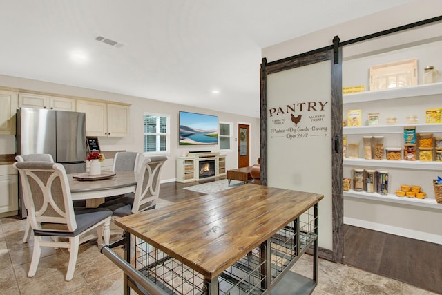 dining space with a barn door