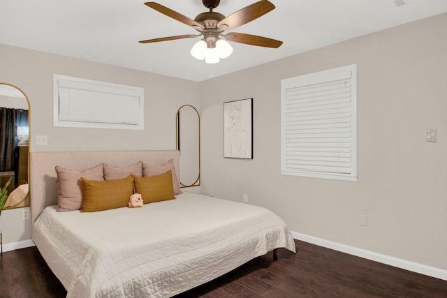 bedroom featuring ceiling fan and dark wood-type flooring