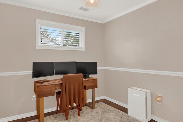 home office with hardwood / wood-style floors and ornamental molding