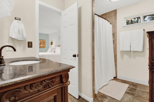 bathroom with a shower with curtain and vanity