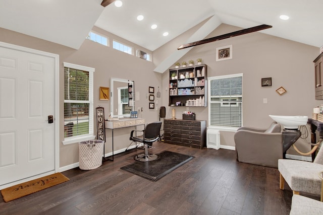 office area with dark hardwood / wood-style flooring, high vaulted ceiling, and a healthy amount of sunlight