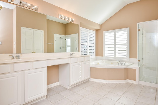 bathroom with tile patterned flooring, shower with separate bathtub, vanity, and lofted ceiling