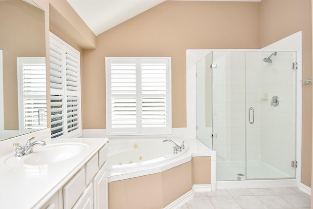 bathroom with plus walk in shower, tile patterned flooring, vanity, and lofted ceiling