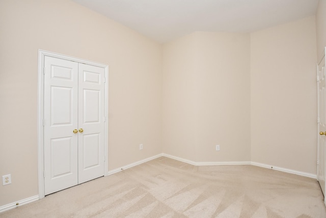 spare room with light carpet