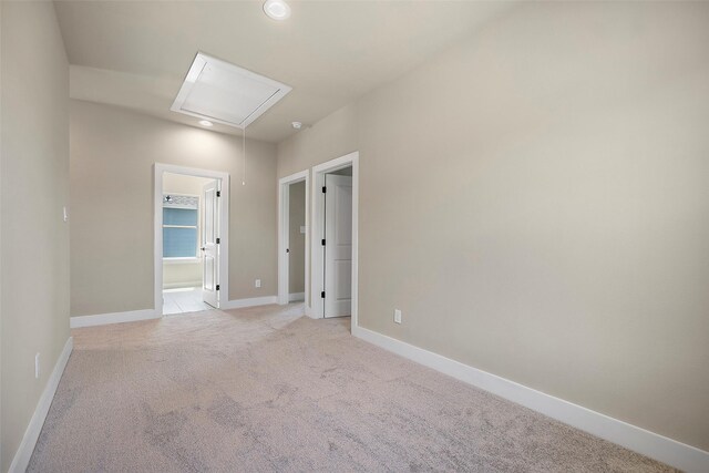 empty room featuring light carpet