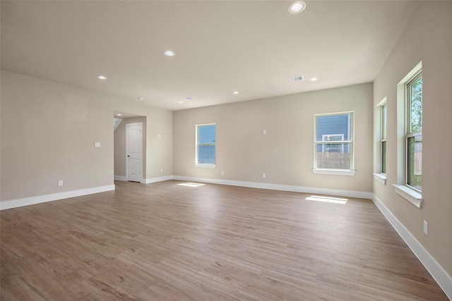 unfurnished room with light hardwood / wood-style flooring