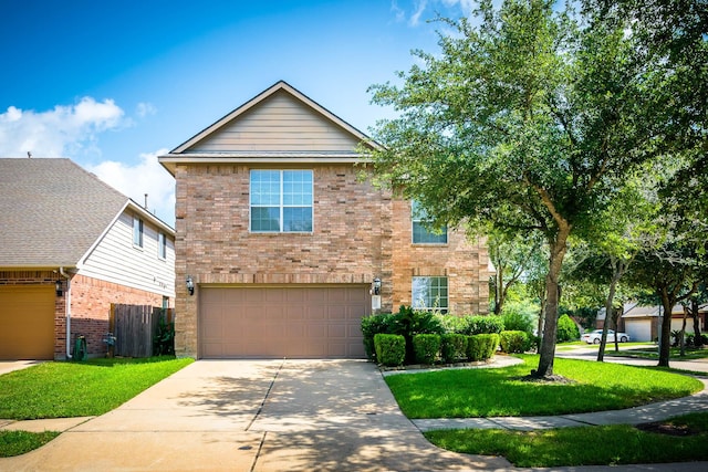 view of property featuring a garage and a front lawn