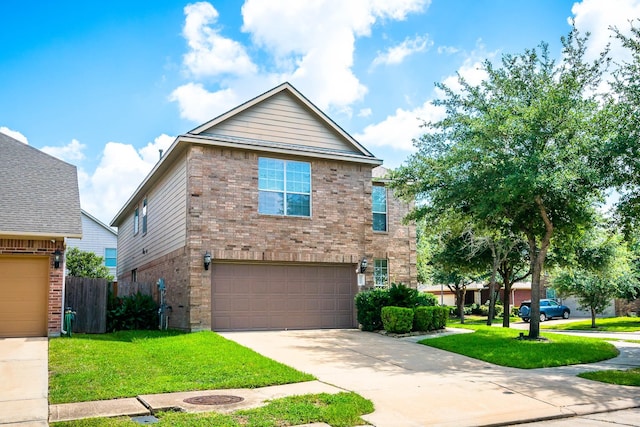 view of front of house with a front yard and a garage