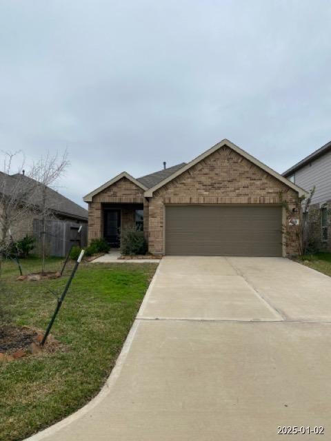 ranch-style house with a garage and a front yard