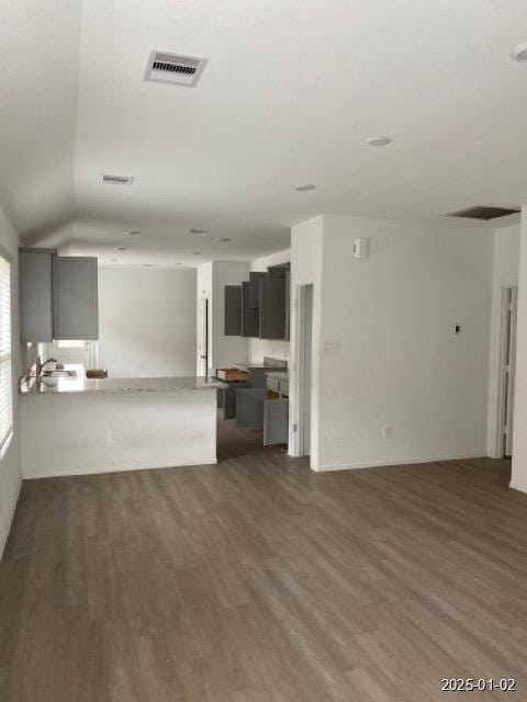 unfurnished living room featuring dark hardwood / wood-style floors