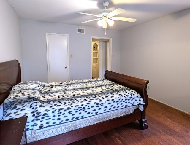 bedroom featuring dark hardwood / wood-style floors and ceiling fan