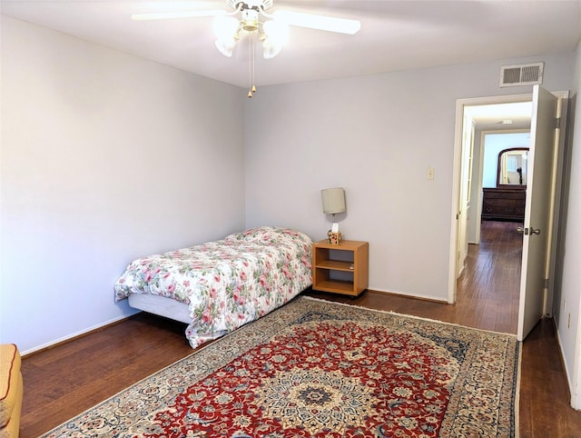 bedroom featuring ceiling fan and dark hardwood / wood-style flooring