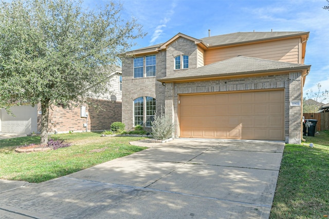 view of front of property featuring a front lawn and a garage