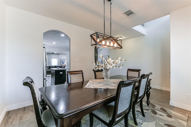 dining area with hardwood / wood-style flooring