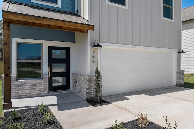 view of exterior entry featuring a garage