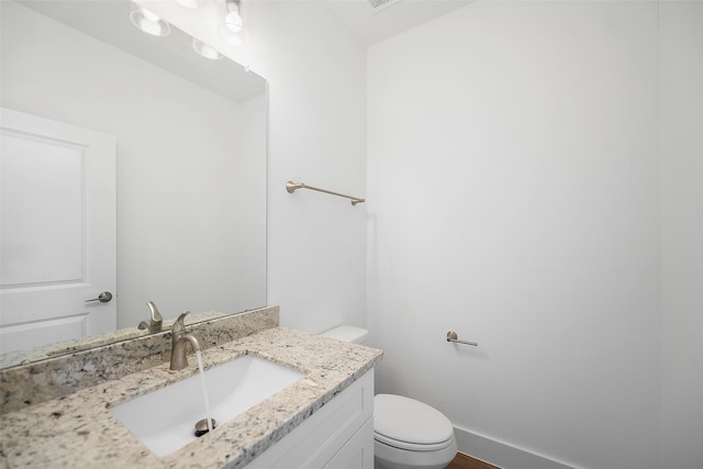 745 20th St, Hempstead, TX 77445 - bathroom featuring vanity and toilet
