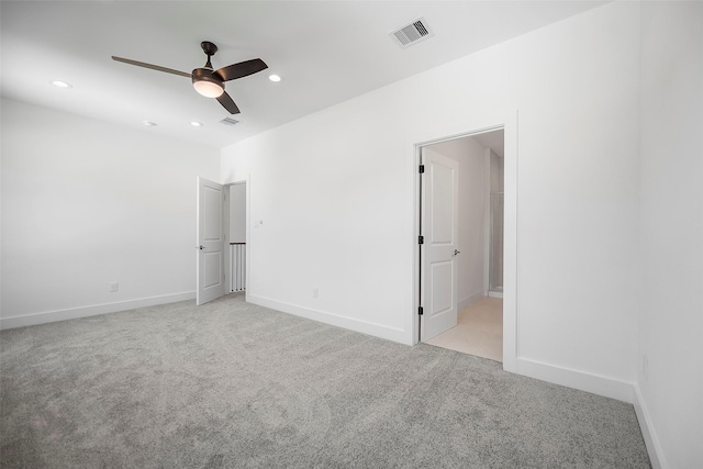 745 20th St, Hempstead, TX 77445 - unfurnished bedroom featuring ensuite bath, ceiling fan, and light carpet