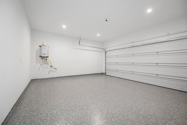 745 20th St, Hempstead, TX 77445 - garage featuring tankless water heater