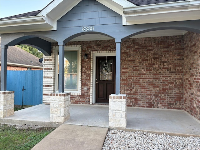 property entrance with covered porch