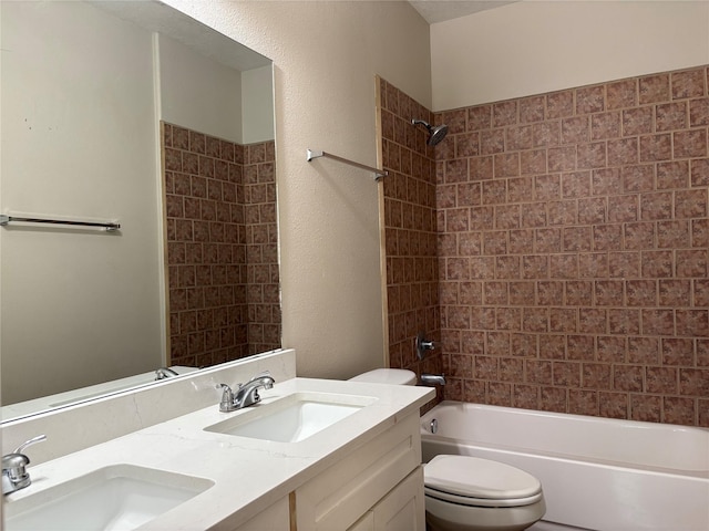 full bathroom with vanity, toilet, and tiled shower / bath