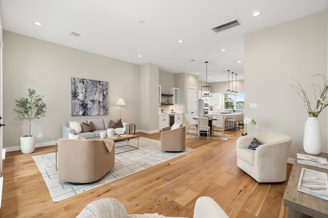 living room with light hardwood / wood-style floors